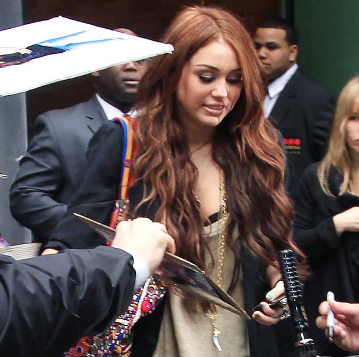 Miley Cyrus Signing Autographs