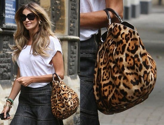 Elle Macpherson carrying a leopard bag while arriving at a church