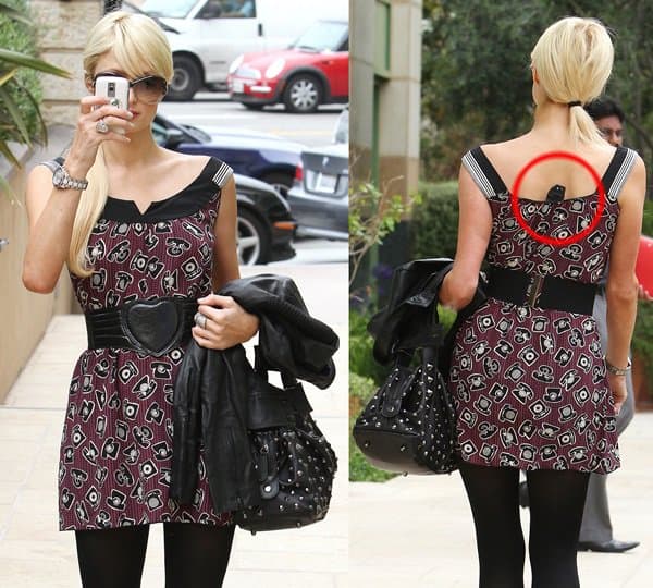 Paris Hilton's dress tag is flipped-up and shows she's wearing a size small dress