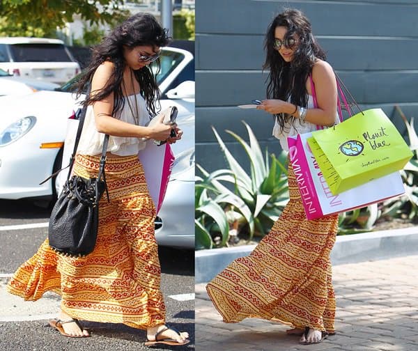 Vanessa Hudgens in a boho-look dress texting on her Blackberry cellphone and looking quite nervous as she continually bites her nails while she shops at Cross Creek in Malibu on June 27, 2010