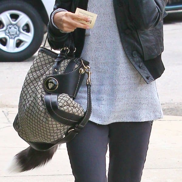 Ashley Tisdale carries her sophisticated Gucci black Diamante Canvas Crest Boule medium top handle bag