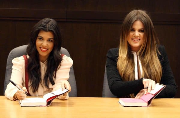 Khloe Kardashian and Kourtney Kardashian sign copies of their new book Dollhouse
