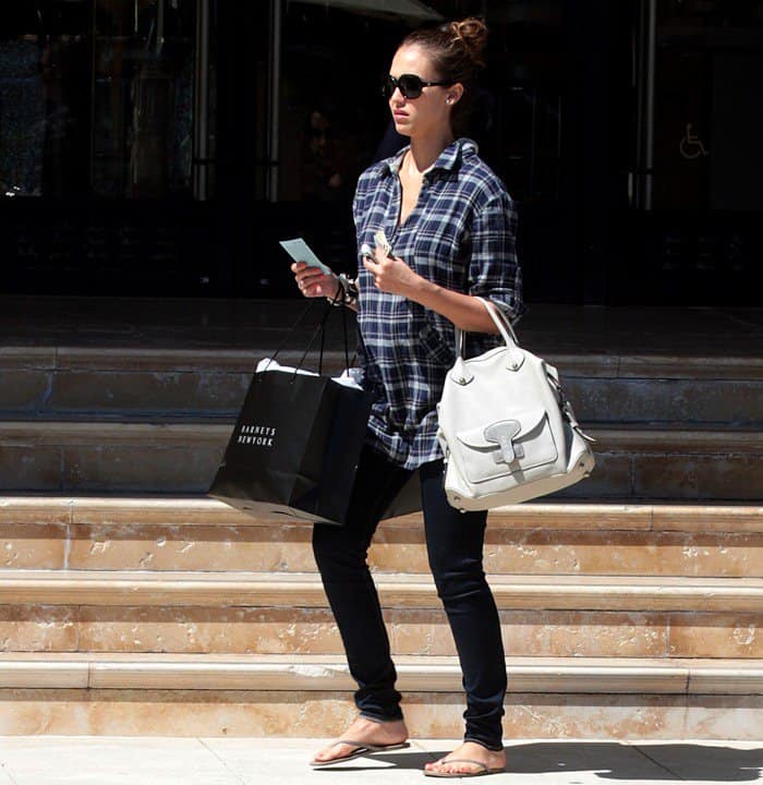 Jessica Alba shows off her baby bump while exiting Barneys New York in Beverly Hills on April 26, 2011
