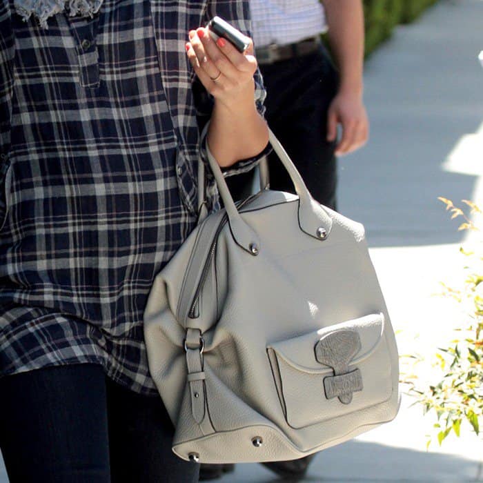 Jessica Alba carries a beige Loewe May bag