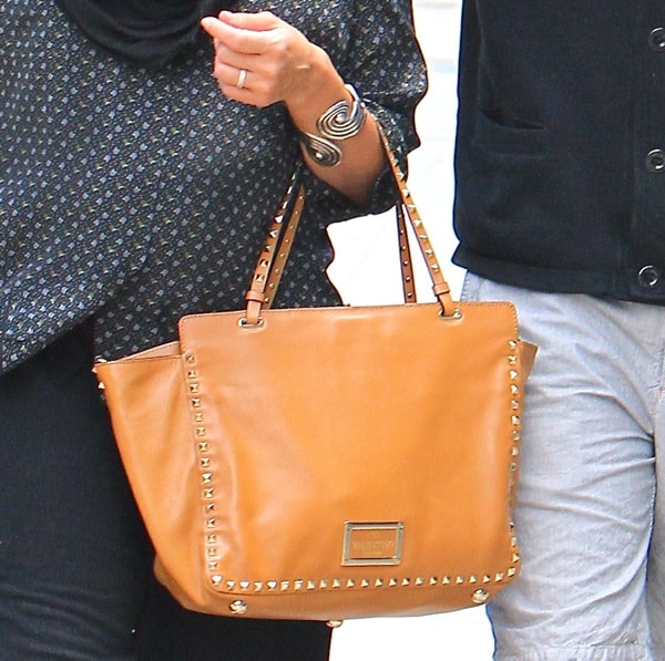 Jessica Alba carries studded camel colored Valentino bag