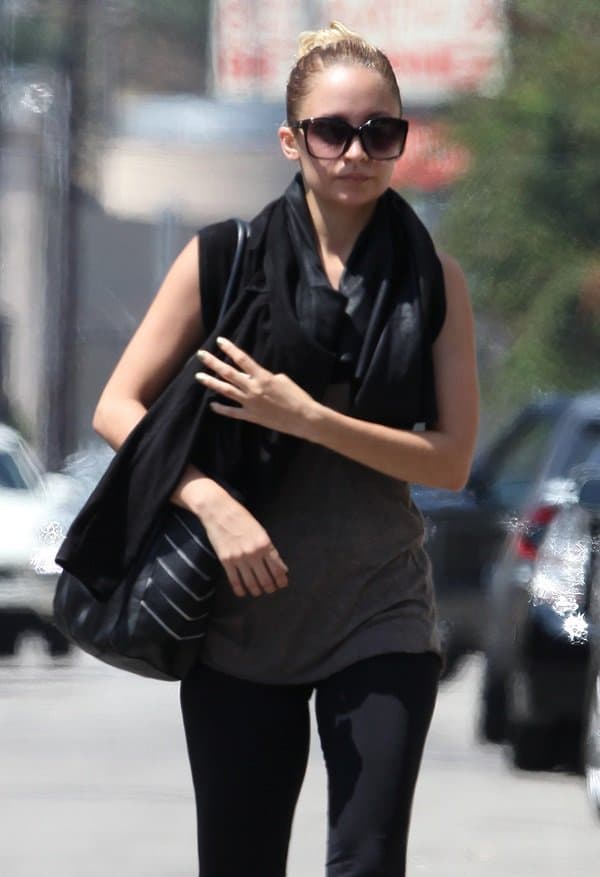 Nicole Richie has been busy toting a new arm candy