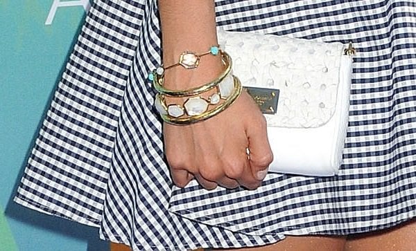 Nina Dobrev toted a quilted white clutch from D&G