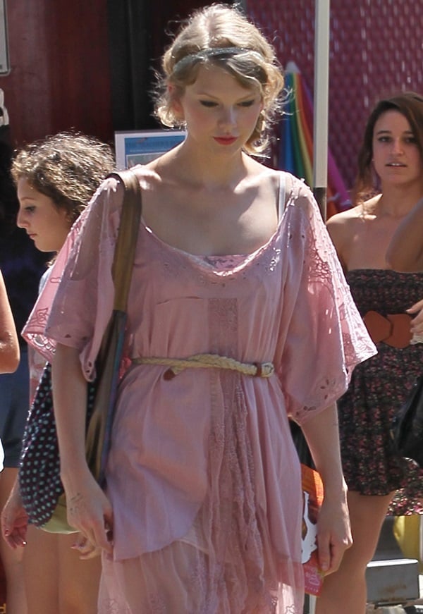 Taylor Swift toted a Wonderstruck bag and wore Free People's New Romantics All the Best embroidered dress