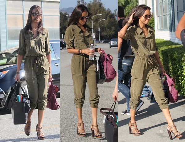 Zoe Saldana looking extremely chic in a camouflage jumpsuit paired with stunning sandals and an eye-catching purple purse
