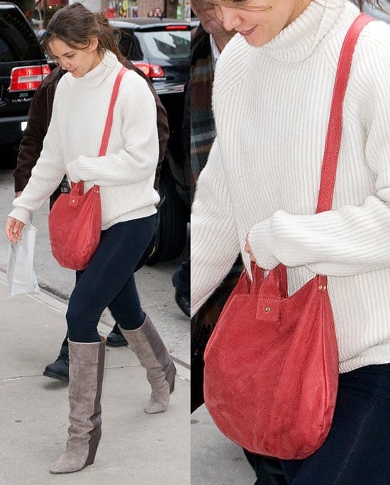 Katie Holmes totes a poppy red bag from Clare Vivier
