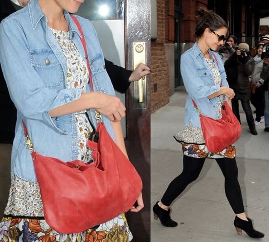 Katie Holmes leaving her Manhattan Hotel in a denim shirt and carrying an oversized red handbag