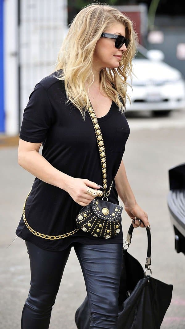 Fergie rocks Helmut Lang's stretch-leather leggings in Los Angeles on October 11, 2012