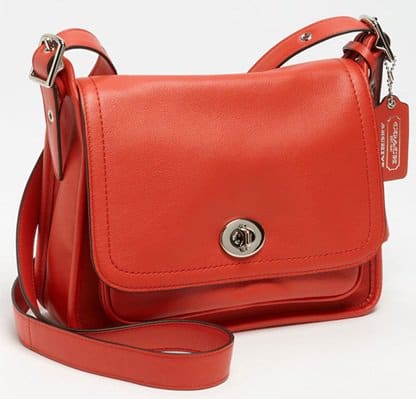 A tassel-trimmed crossbody embodies classic design with a trim silhouette cast in supple glove-tanned leather