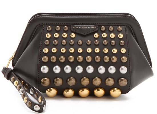 A structured clutch fashioned in smooth and sturdy leather and detailed with graduated, mixed-metal studs for a pop of punk-inspired sophistication