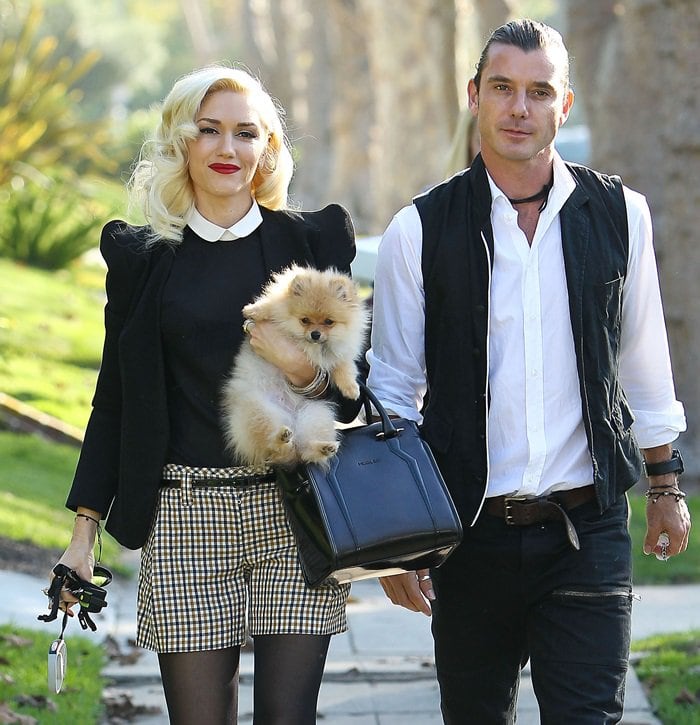 Gwen Stefani was dressed in preppy retro-style and sported an interesting black patent arm candy