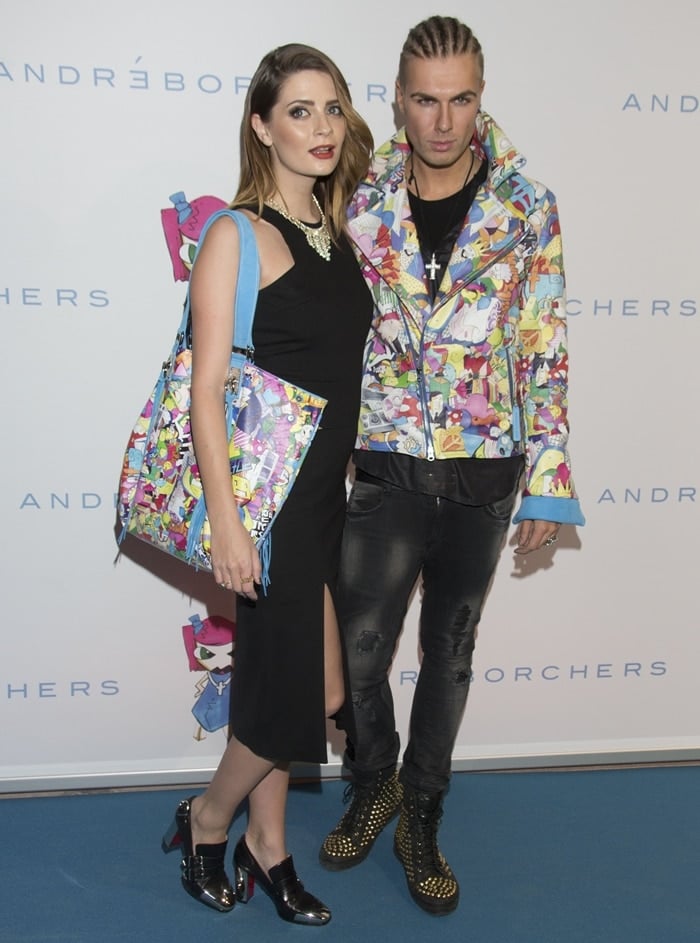 Mischa Barton posing with German fashion designer Andre Borchers at the launch of KIN by Andre Borchers bag collection