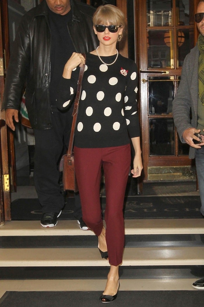 Taylor sporting a French Connection ‘Polka Dot’ sweater and Theory pants in London on November 7, 2012