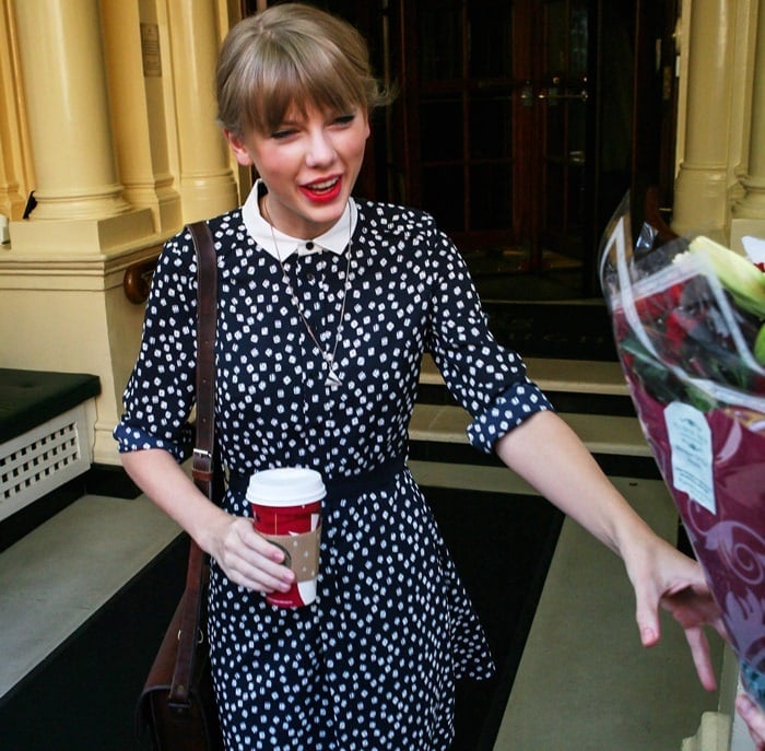 Taylor Swift looks cute in a polka dot dress as she leaves her hotel in London, England, on November 7, 2012