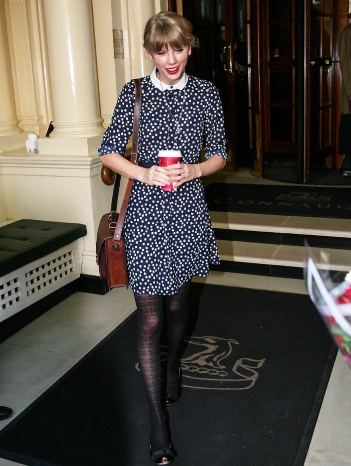 Taylor Swift looks cute in a polka dot dress as she leaves her hotel in London, England, on November 7, 2012