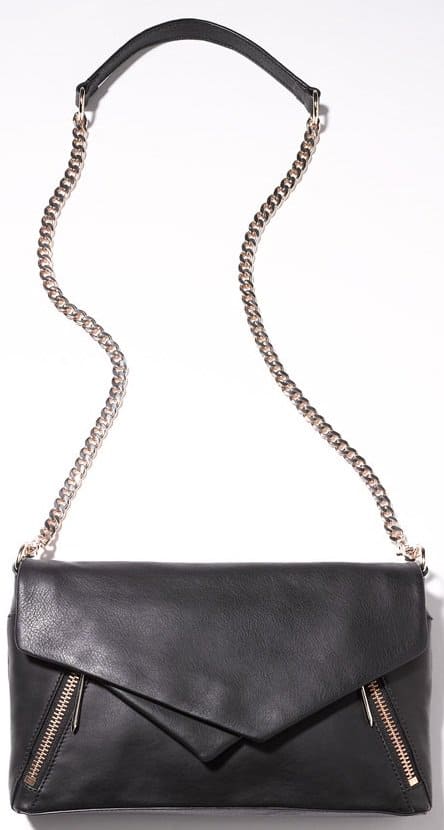 Angled zip pockets echo the off-kilter geo flap of an edgy leather clutch highlighted with goldtone glint