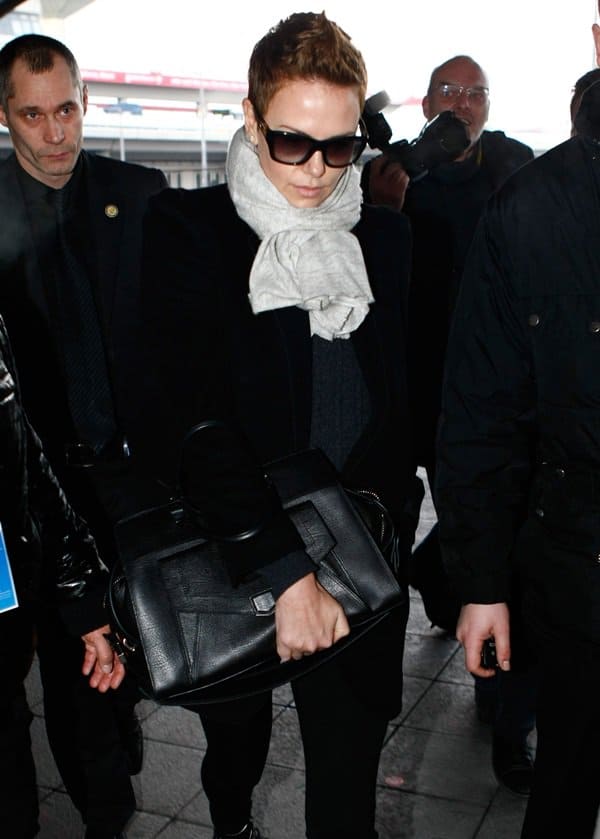 Charlize Theron totes a Proenza Schouler PS13 geometric tote