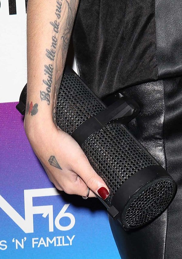 Cher Lloyd's cylindrical black studded clutch