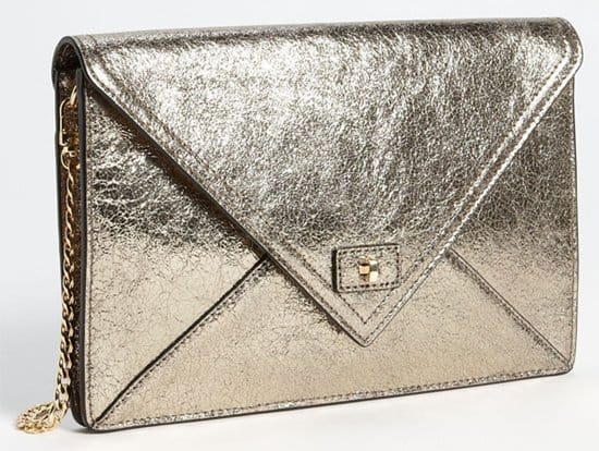 A radiant gold finish illuminates the crackled leather of a clean-cut envelope clutch furnished with an optional chain strap