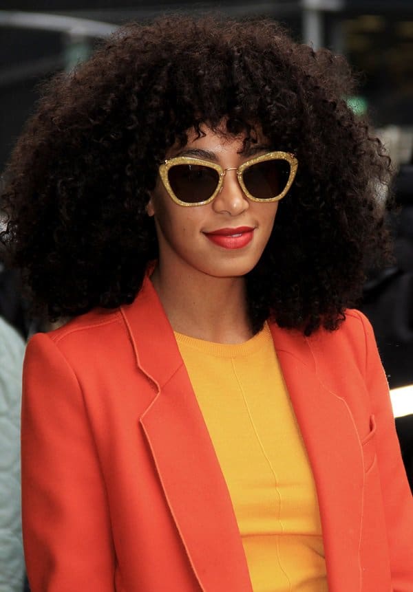 Solange Knowles rocks gold Miu Miu sunglasses