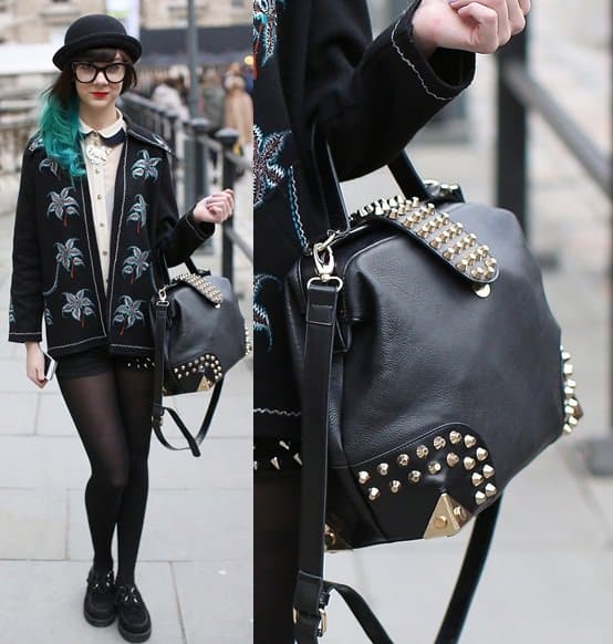 Model carrying an edgy studded purse