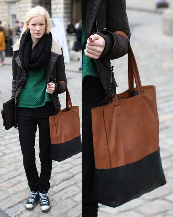 Blonde model carrying a colorblock tote