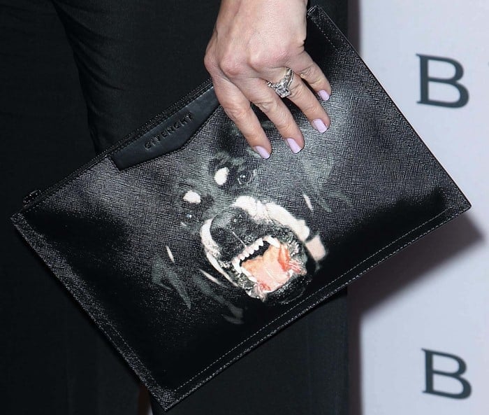 Drew Barrymore totes a Rottweiler-printed clutch by Givenchy