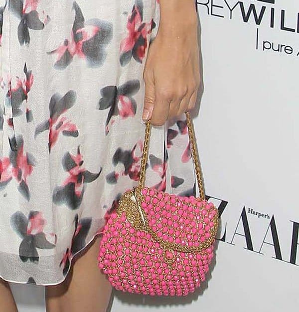 Zuleikha Robinson toted a pink beaded purse