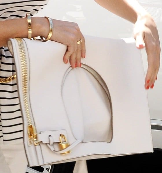 Kourtney Kardashian's white large foldover clutch