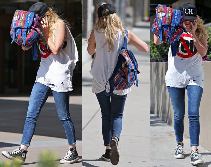 Ashley Benson trying to hide from photographers while shopping on Robertson Boulevard in Los Angeles