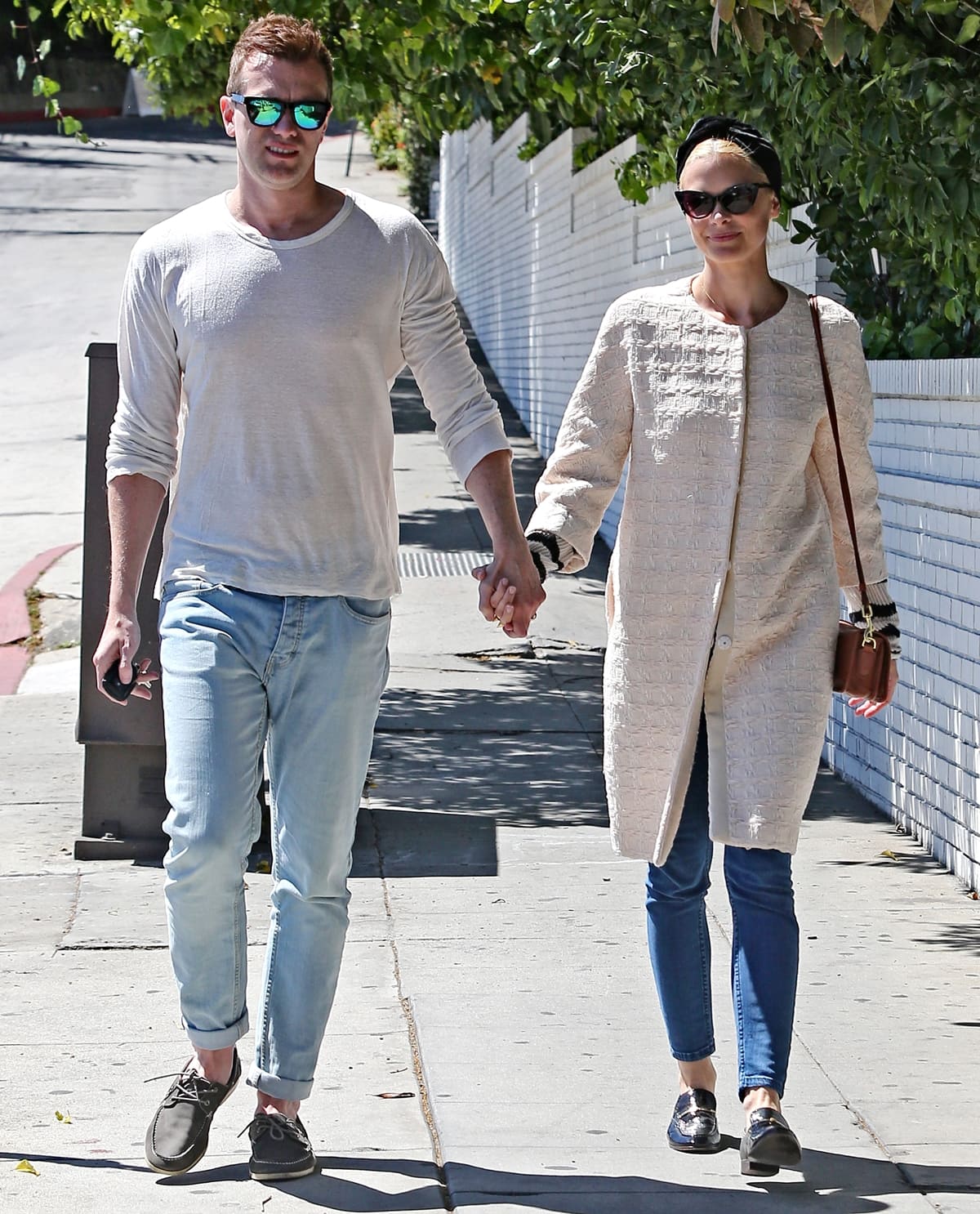 Jaime King and husband Kyle Newman seen walking while holding hands in West Hollywood