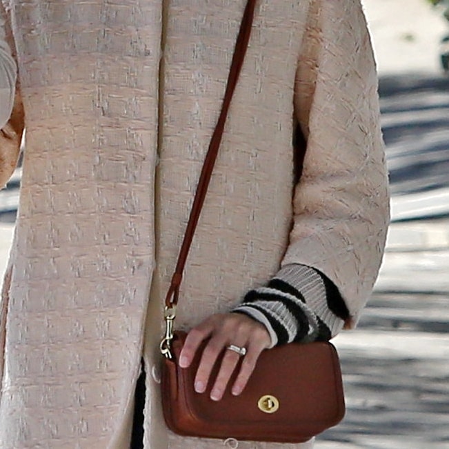 Jaime King's small crossbody bag from Coach is handcrafted from rich, lustrous leather