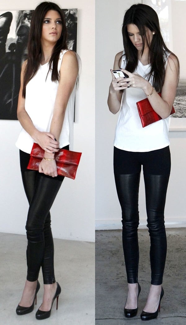 Kendall Jenner at the Nomad Two Worlds exhibit with a hot red snakeskin foldover clutch