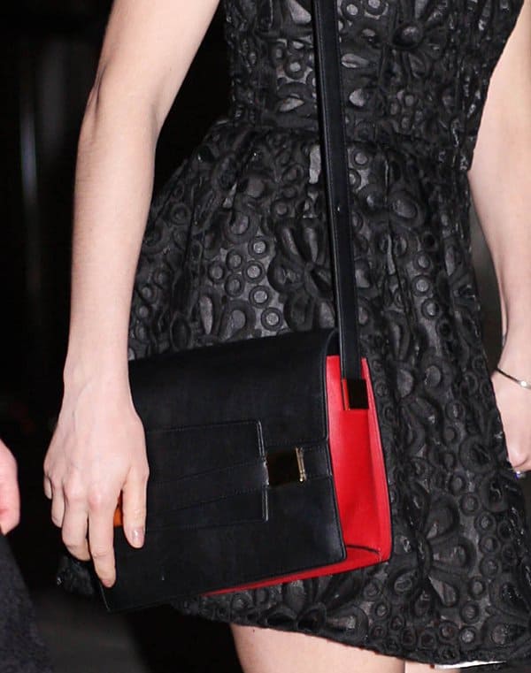 Sienna Miller carrying a Delvaux Madame PM bag