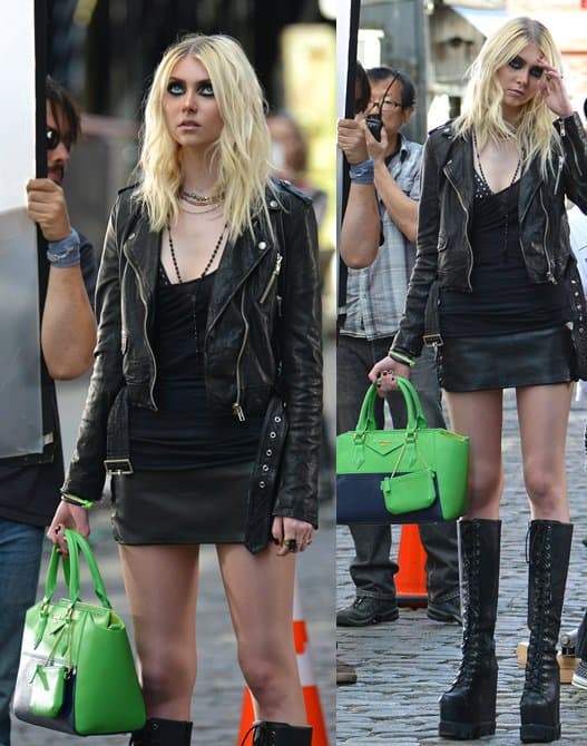 Gothic Taylor Momsen flaunts her legs in a fitted tank paired with knee-high boots