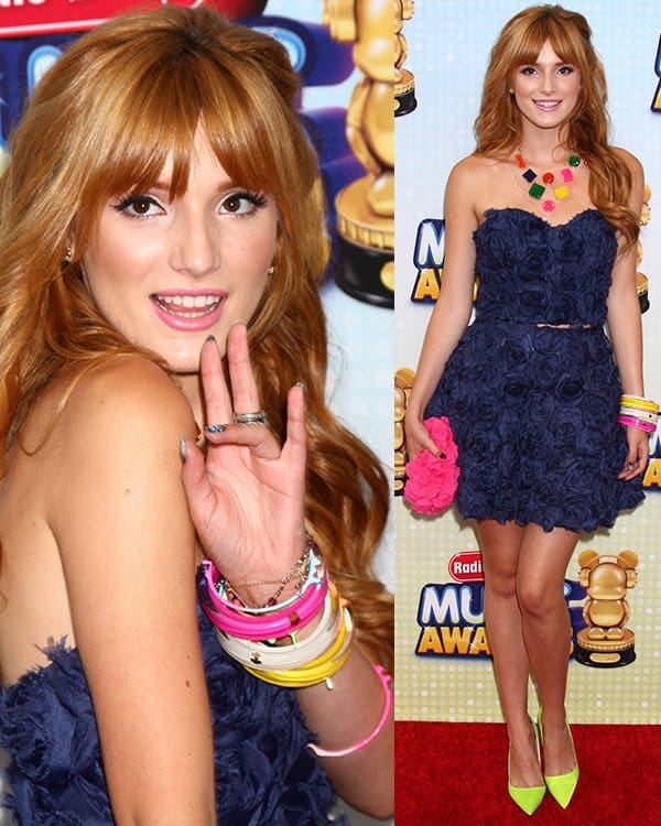 Bella Thorne stood out in her navy blue rosette crop top and skirt at the Radio Disney Music Awards 2013