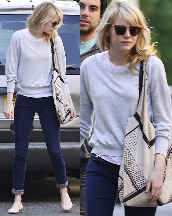 Actress Emma Stone kept her look casual and cool in a sweatshirt and a pair of jeans and of flats