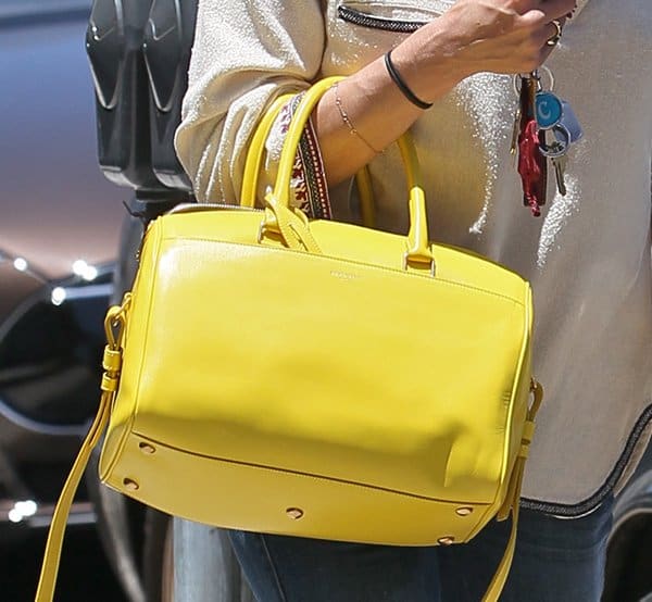 Selma Blair carrying a yellow purse from Saint Laurent