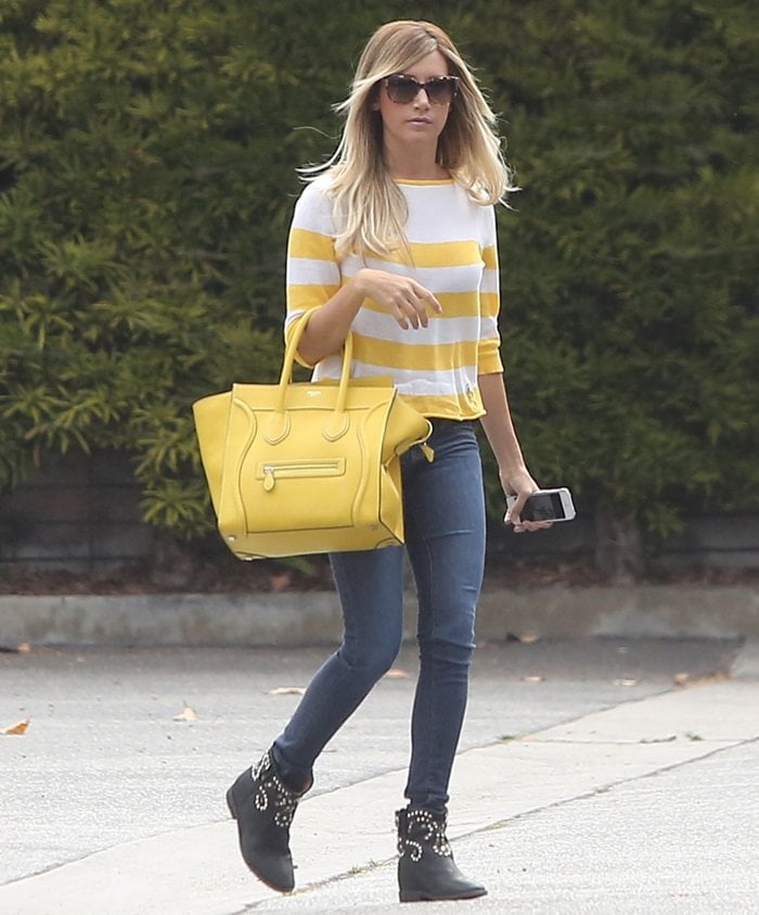Actress Ashley Tisdale toted the same bag with sunglasses, blue skinny jeans, a striped sweater from Lark And Wolff By Steven Alan, and black studded boots from Isabel Marant