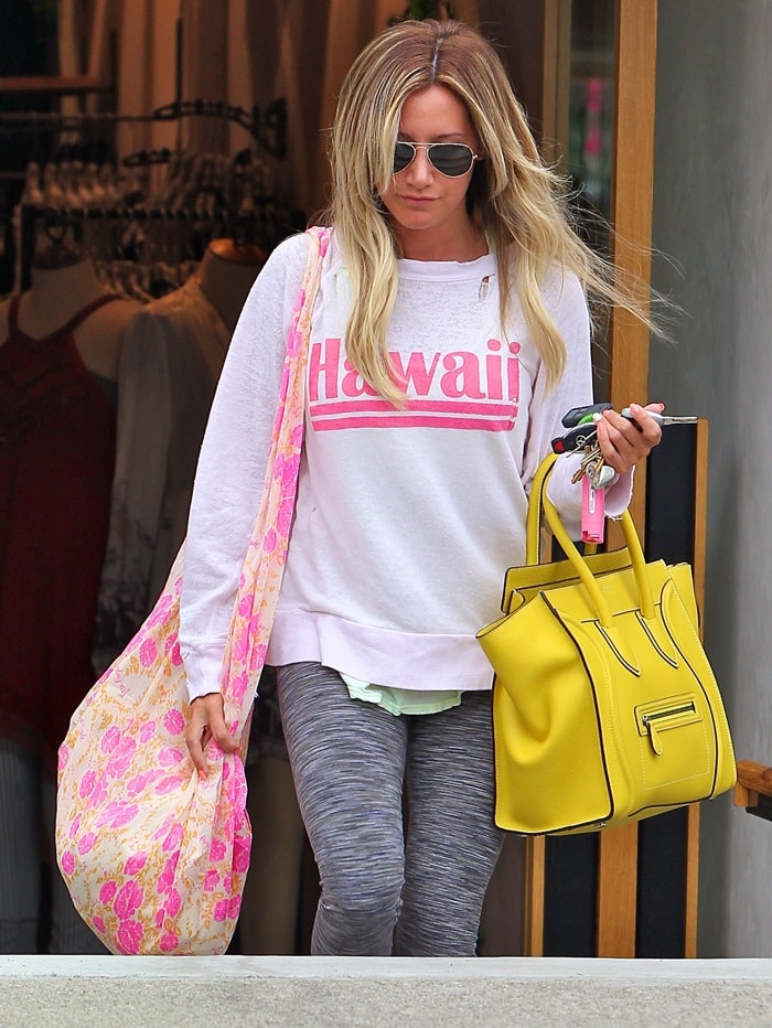 Ashley Tisdale sporting a “Hawaii” shirt as she heads back to her car after doing some retail therapy at a local store in Studio City, California, on July 11, 2013