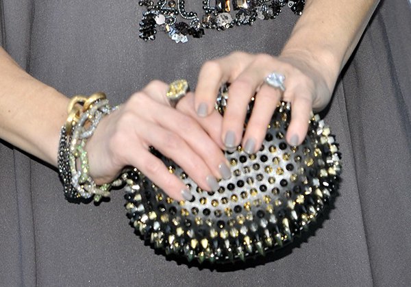 Kate Hudson carrying a spiked 'Mina' clutch from Christian Louboutin