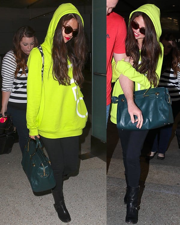 Selena Gomez arrives at LAX Airport on a flight in from Europe accompanied by her bodyguard on July 10, 2013