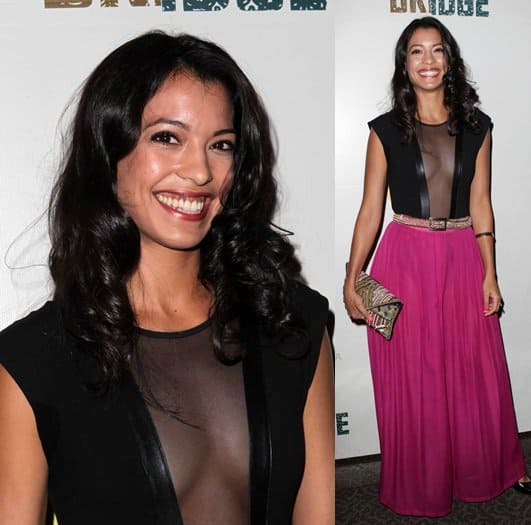 Stephanie Sigman pairing her leather-trimmed dress with an exquisitely beaded clutch for The Bridge premiere
