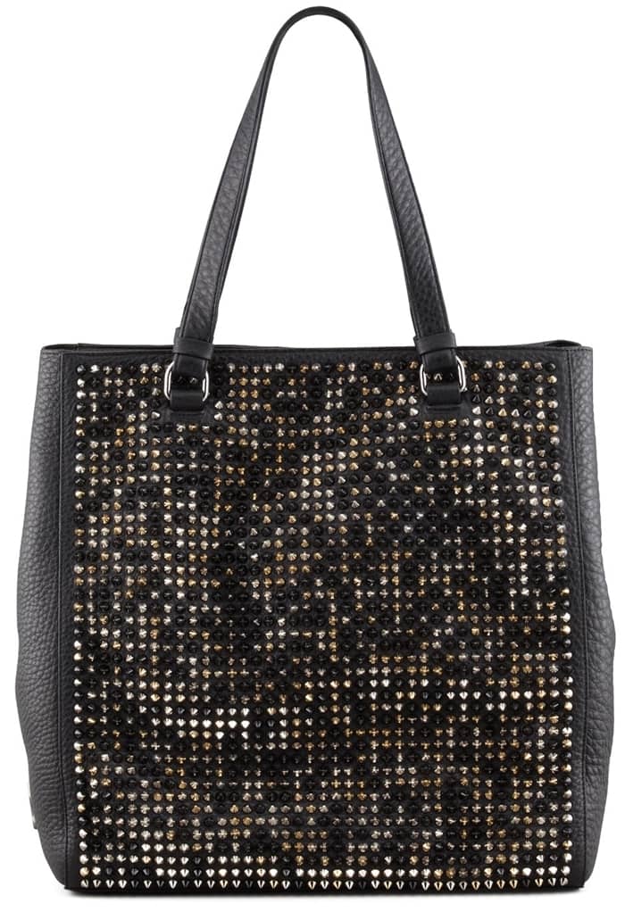 Loaded with edgy spikes, this tote is as protective as it is posh