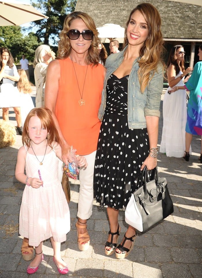 Macy Falco, Edie Falco, and Jessica Alba attend Ralph Lauren’s Day at the Stables fashion show to preview the Fall/Holiday 2013 collection at Wölffer Stables in Sagaponack, New York, on August 5, 2013
