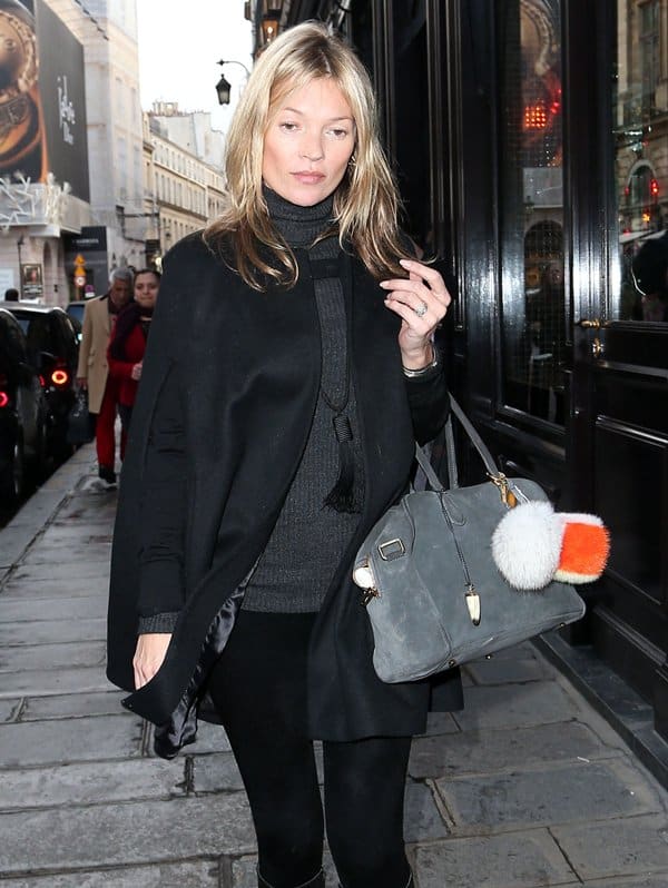Kate Moss carries a Balmain x Aurelie Bidermann “Pierre” bag in Paris